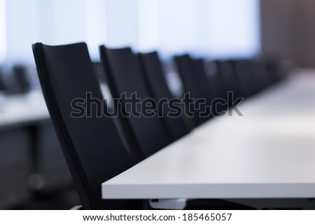 Table and chairs in meeting room.