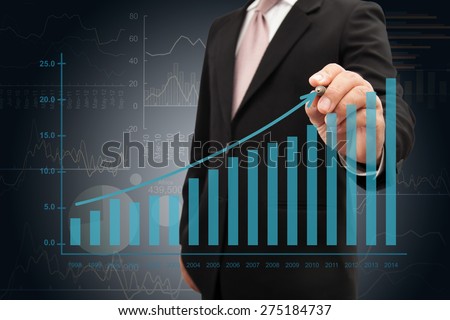 Investor with growth chart of profits.