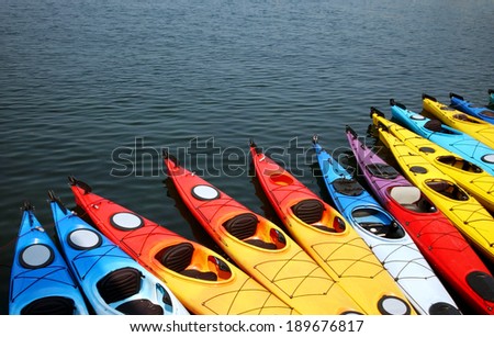Colorful kayaks align the waters of Gloucester, Massachusetts