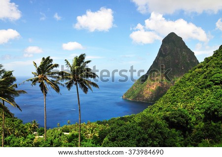 Piton Petite sits like a cone in the ocean below, in the Bay of Piton\'s in tropical Saint Lucia