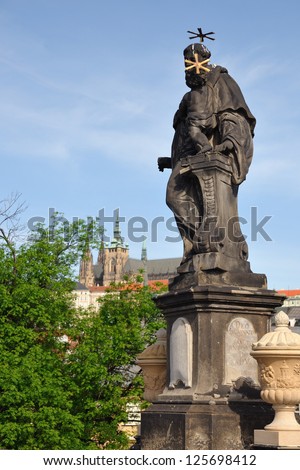 Statue Catholic saint Anthony of Padua with Baby Jesus on the Charles Bridge on the river Vltava, Prague, Czech Republic