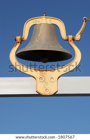 Rustic bell at a lake marina