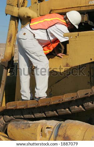 Construction worker and crane