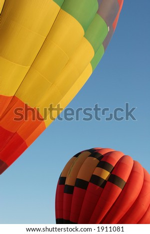 Two balloons taking off