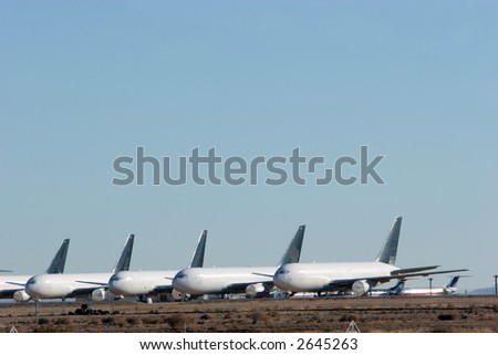 Commercial airplanes lined up for maintenance