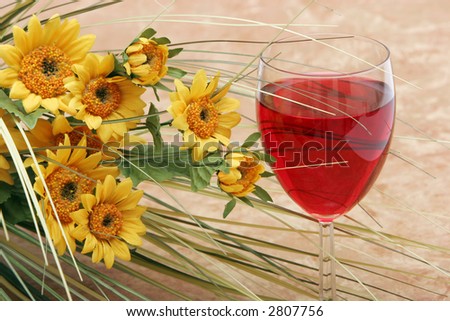 Red wine and yellow daisies
