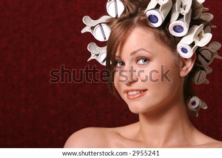 Beautiful woman in hair rollers