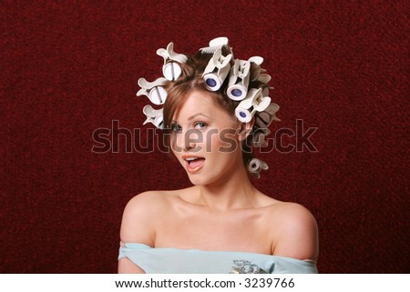 Girl with hair rollers on her hair
