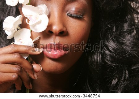 stock photo Beautiful sexy black woman with orchid