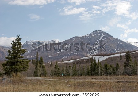 Snow melting on mountains in Alaska Range
