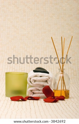 Spa towels, fragrance sticks, candle and rose petals