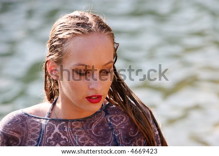 Woman swimmer getting out of the water