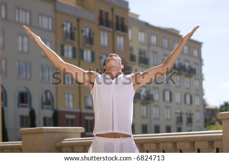 Young man with open arms