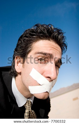 Businessman with a duct tape on his mouth