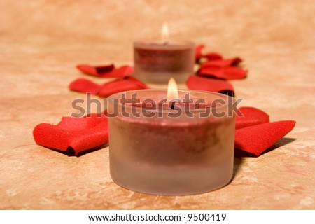 Romatic scented candles and rose petals