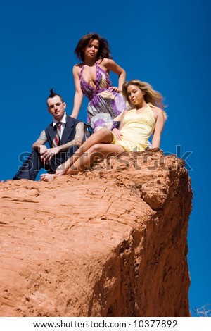 stock photo : Fashionable sexy girls and fashionable male with mohawk hairstyle