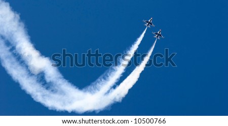 F-16 Thunderbird jets leaving smoke trails