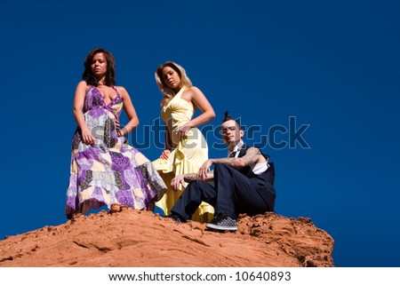 stock photo : Fashionable sexy girls and fashionable male with mohawk 