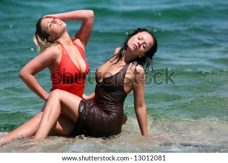 Couple sexy girls in wet dresses