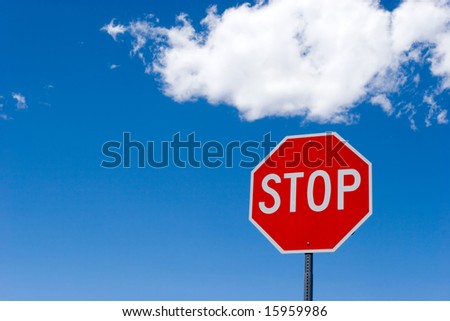 Stop sign for traffic against blue sky