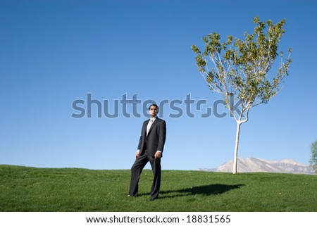 Confident businessman in dark suit