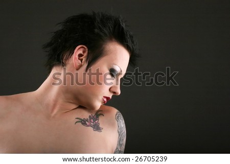 stock photo : Beautiful young woman with gothic hairstyle and makeup