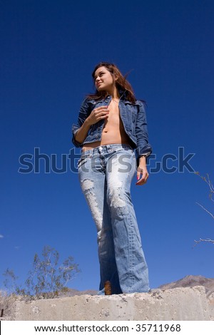 Casual young woman in blue jeans