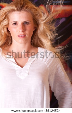 Head shot of a beautiful woman on colorful background