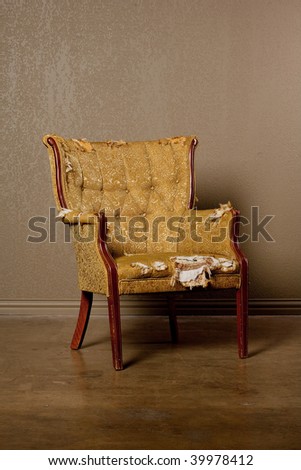 Old antique chair in need of repair and upholstery