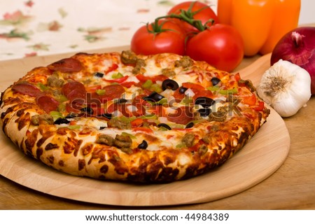 Delicious supreme pizza with meat and vegetables