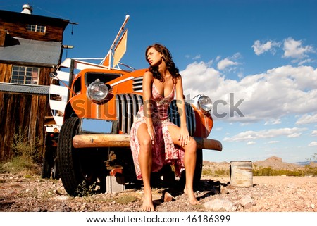 Sexy woman posing on a truck