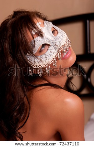 Sexy woman in white mask