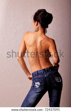 stock photo Topless japanese woman wearing blue jeans back shot