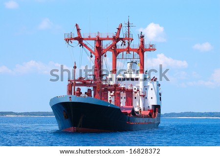 Transportation ship at sea preparing to enter port