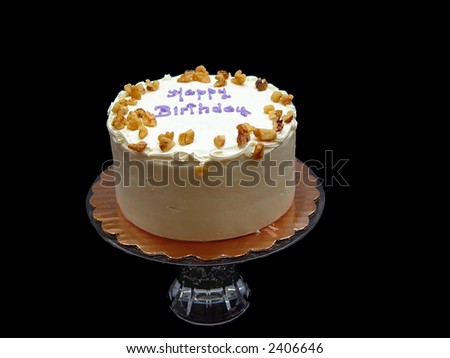 Tasty birthday cake with white frosting and nuts.  (Carrot Cake)