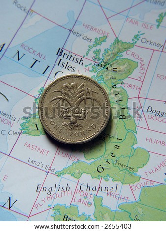 Backside of a British One Pound Coin on Great Britain map.