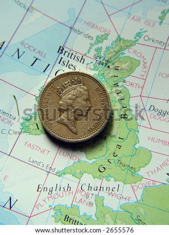 British one pound coin on map of Great Britain