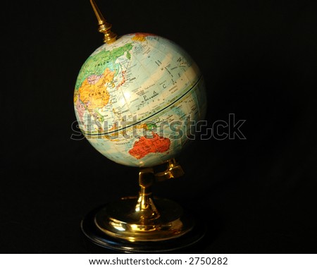 Blue world globe on black with old Soviet Union.