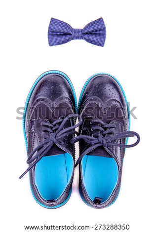 bow tie and modern shoes are isolated on white background