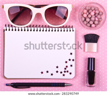 beautiful women\'s minimal set of fashion accessories on a pink background. Place for text. Ideal for blogs or magazines. Mock up. Decorated with stars. Polka dots