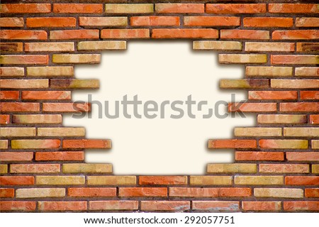 old brown brick wall with a hole in the middle, place for text