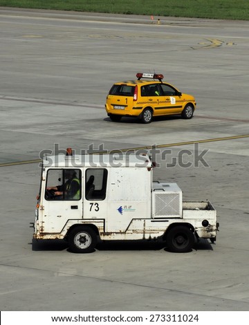 KATOWICE, POLAND - SEPTEMBER 3, 2011: Services cars parked at the airport field on September 3, 2011 in Katowice airport, Poland.
