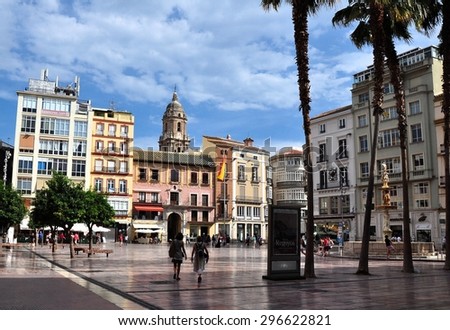 MALAGA, SPAIN - OCTOBER 4:Tourists walk around the historic center of Malaga on October 4, 2014.