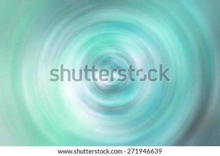 Abstract blurred turquoise background with spin circle radial motion blur