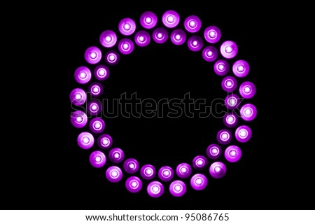 Ring of purple LED lights on black background