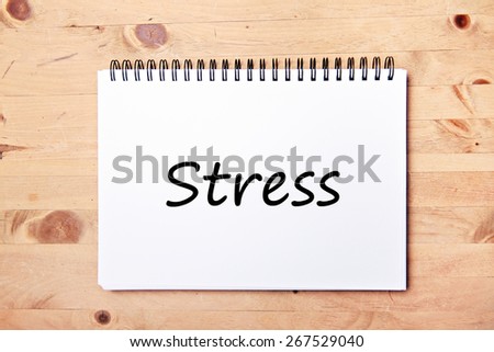 writing pad on wood table  - stress