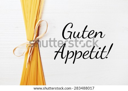 food background - pasta on wood table - german for ejoy your meal