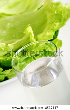 green iceberg salad with a glass of water