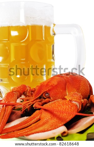 The Red crayfish on saucer and mug of beer. The White background. Isolated.