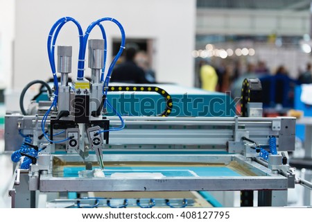 Silk screen printing machine in printing factory